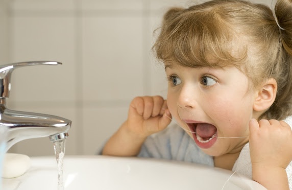 This is the image for the news article titled Which Is Better: Traditional Floss or Water Flossers