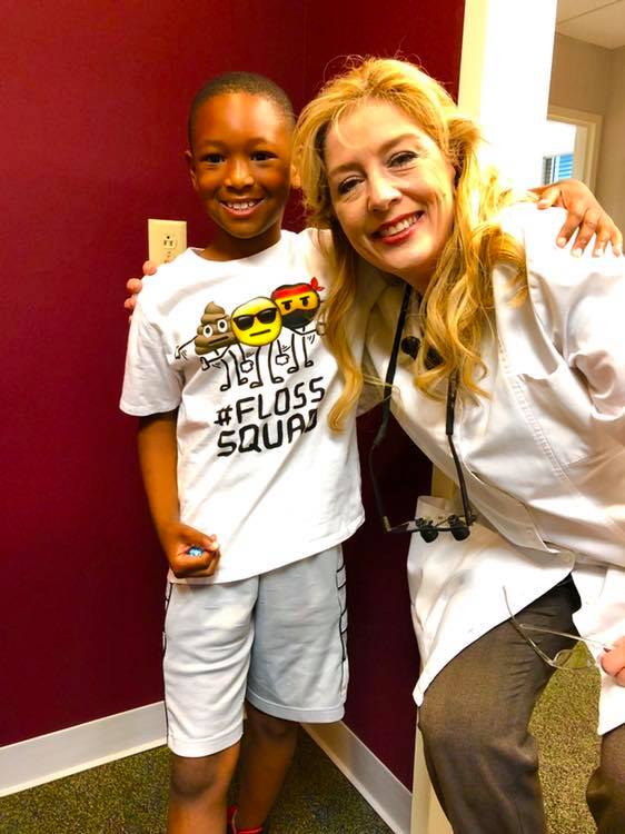 dr shah with one her young patients in macon ga